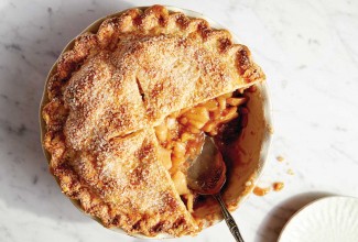 Cut apple pie with filling spilling out