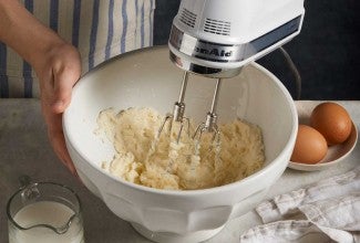 Electric beater creaming butter and sugar
