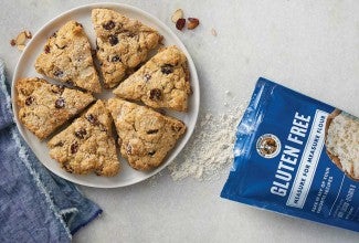 Gluten-free flour bag next to plate of scones