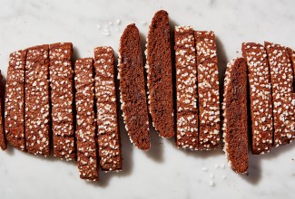 Chocolate brownie biscotti cut into slices, topped with pearl sugar