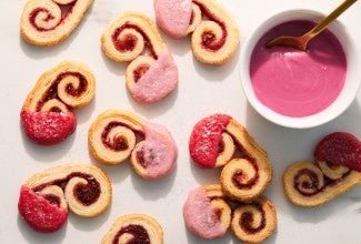 Mini raspberry palmiers dipped in pink raspberry glaze