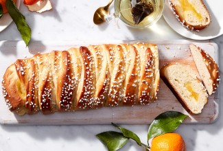 A loaf of braided bread filled with lemon curd and cut into slices