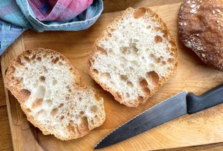 Loaves of sourdough Pan de Cristal cut open to show their interior