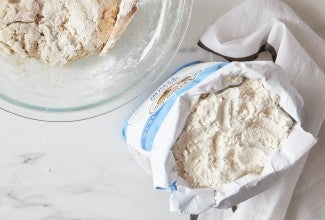 Top down view of open bag of bread flour