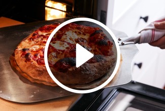 Pizza coming out of an oven - select to zoom