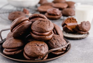 Plate of mocha whoopie pies on a table. 