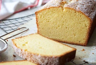 Velvet Pound Cake baked in a loaf pan and sliced to show its fine-textured interior.