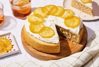 A simple, single layer lemon cake that's frosted and topped with candied lemon slices