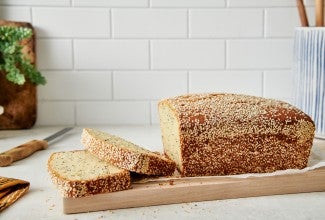 Sliced tahini pound cake with sesame seed crust