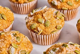 A bunch of Easy Pumpkin Muffins on a table