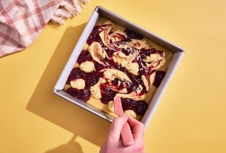 frangipane and raspberry jam being swirled