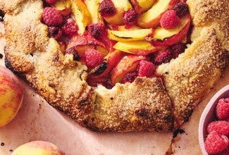 Rustic Peach Tart with peaches and raspberries