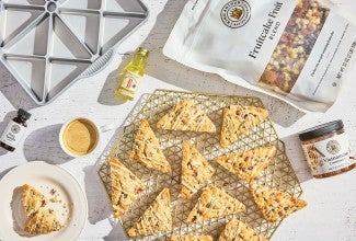 Fruitcake scones photographed from overhead and an arrangement of ingredients from King Arthur Baking.