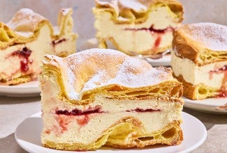 Karpatka Cake on plates showing the layers of cake and filling.