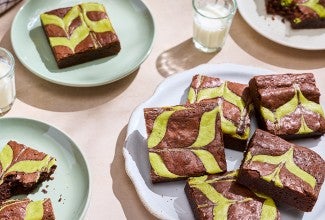 Mint Brownies stacked and arranged on plates.
