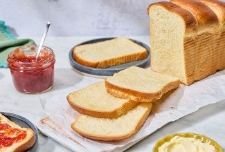 Sourdough Milk Bread sliced an arranged on a counter