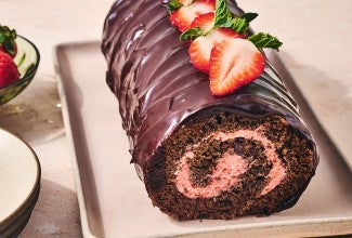 Chocolate Strawberry Roll Cake on a sheet pan