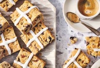 Gluten Free Hot Cross Biscuits and a cup of coffee seen from above