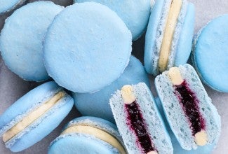 Pile of macarons with one split in half