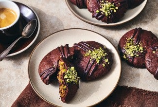 Dubai Chocolate Cookies arranged on a counter and plate with a cup of coffee