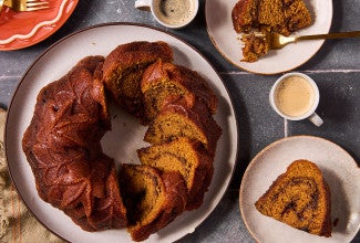 Pumpkin Espresso Bundt Cake shown in the shape of the bundt can but sliced