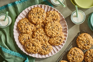 A pile of The Softest Oatmeal Raisin Cookies on a plate seen from above.