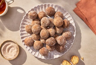 Apple Cider Doughnut Holes arranged on a plate