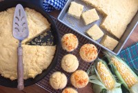 Skillet cornbread, corn muffins, and cornbread in a pan, on a table and ready to serve