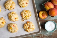 Peach scones on a baking sheet, fresh from the oven.