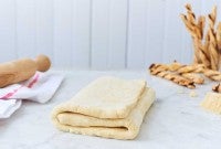 Folded puff pastry dough on the counter