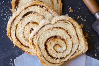 A loaf of cinnamon swirl bread cut into slices