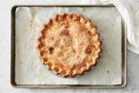 Baked pie on parchment lined baking sheet