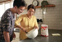Ryan and his mother Ha baking together