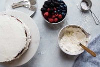 Cake next to bowl of frosting