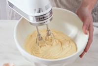 Electric beater mixing cake batter