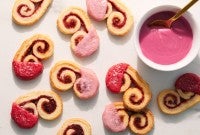 Mini raspberry palmiers dipped in pink raspberry glaze