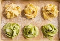 Sourdough Pasta nests on a sheet of parchment