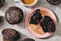 A Chocolate Breakfast Muffin broken open on a plate