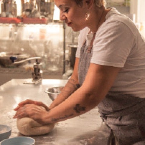 Baker kneading bread