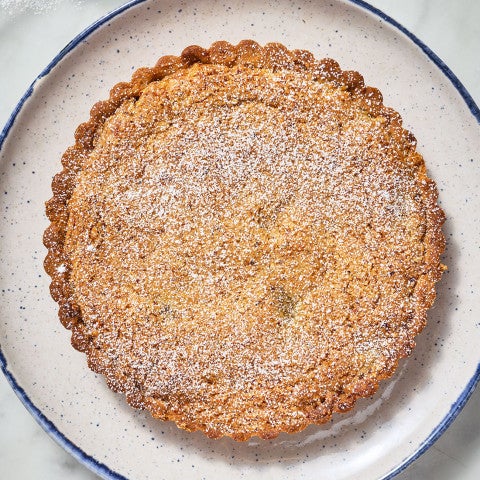 Pecan Cherry Bourbon Tart on a plate seen from above - select to zoom