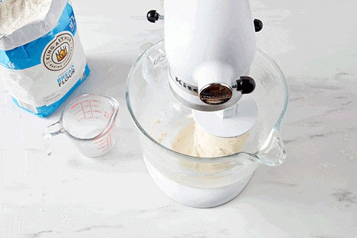 A top-down shot into a mixing bowl showing that the dough should be smooth and elastic when fully kneaded. 