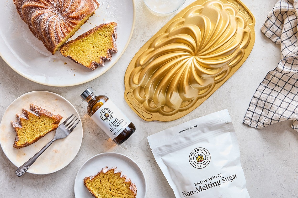 Everyday Olive Oil Cake served on plates at a table