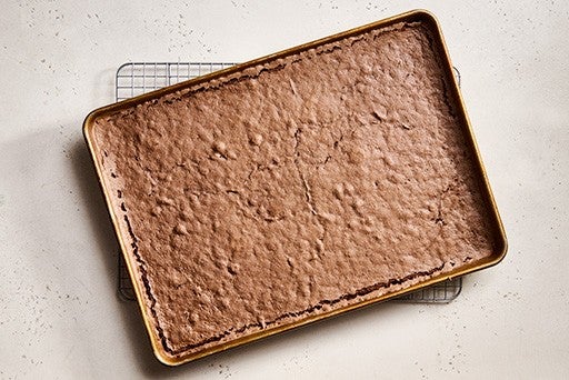 A chocolate sheet cake in a pan.