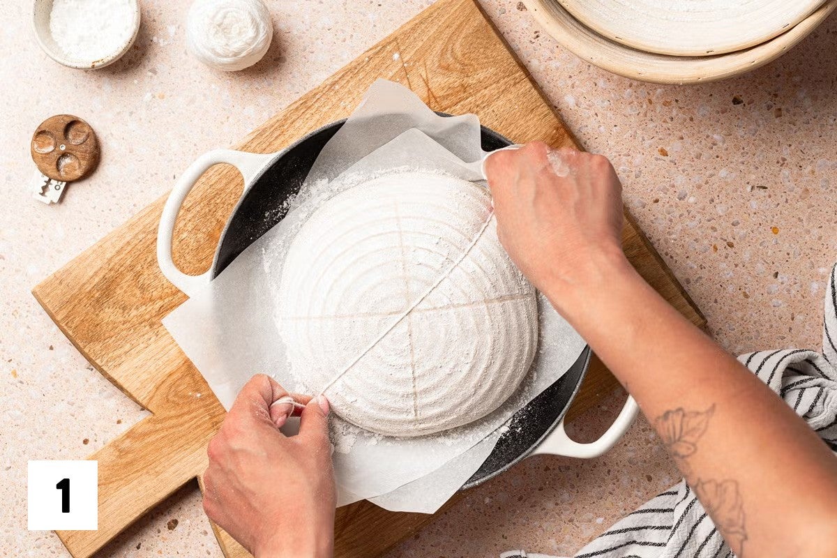 Using butcher's twine to divide a loaf of bread dough into 8 sections