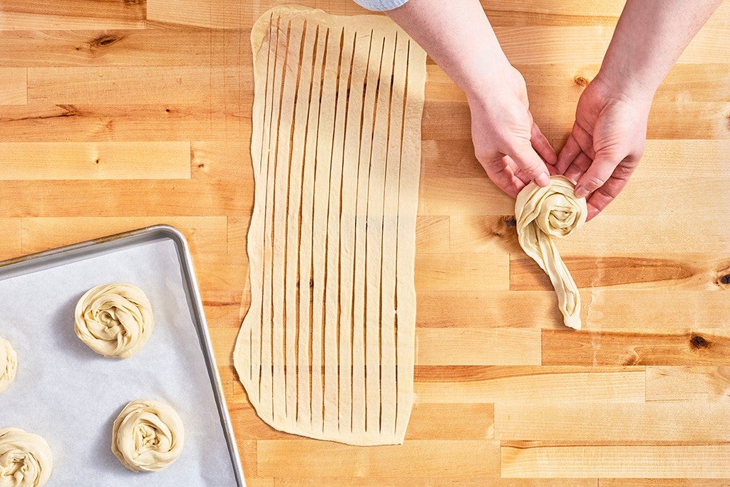 Twisting Thousand Layer Mo dough.