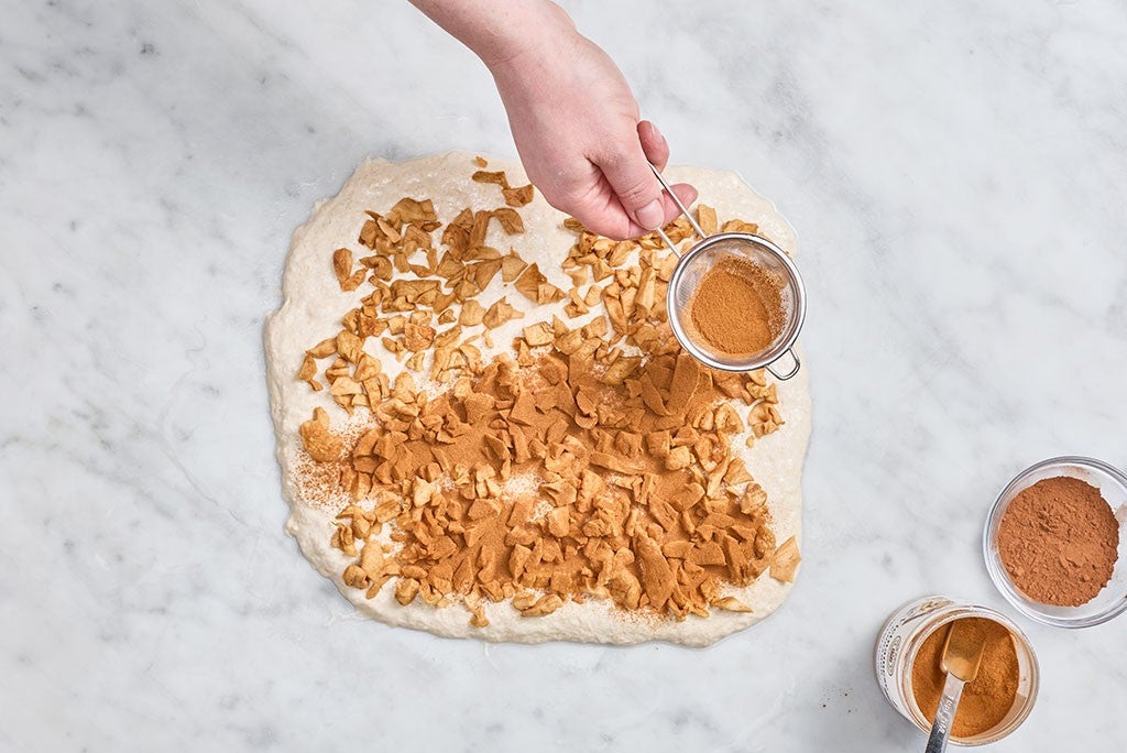 Adding cinnamon to Apple Cinnamon Sourdough Bread dough