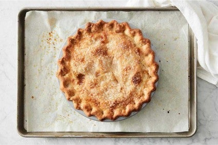 Baked pie on parchment lined baking sheet