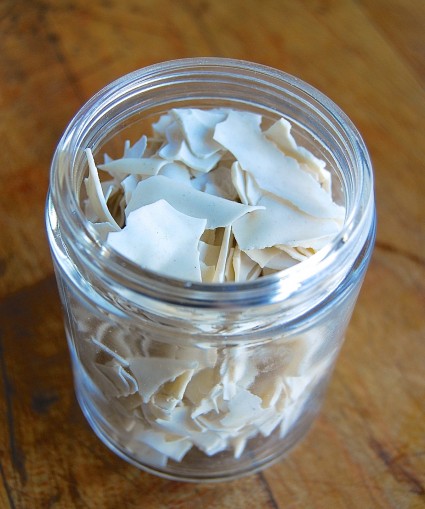 flakes of dried sourdough starter in a jar