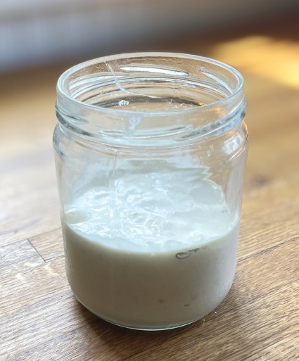 sourdough starter in a jar, fed and ready to  be refrigerated