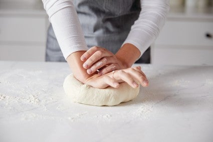 Hands kneading dough 